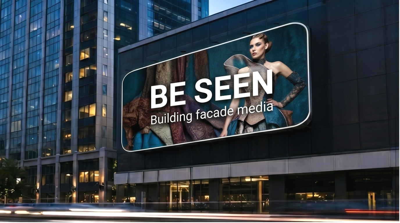 Concept image of a digital billboard mounted on a commercial building facade with the phrase BE SEEN